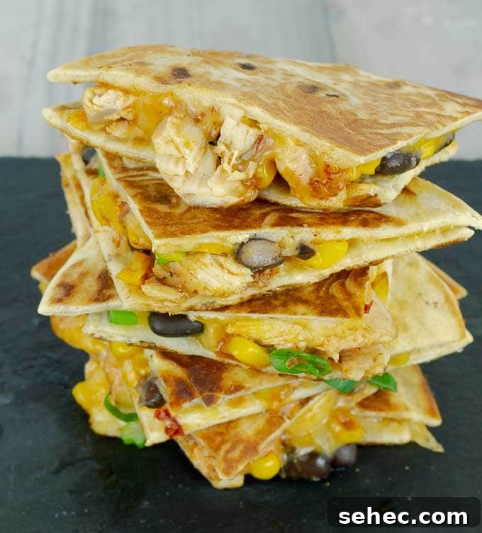 Chipotle BBQ Chicken Quesadillas 4 a tall stack of Chipotle Barbecue Sauce Chicken Quesadillas