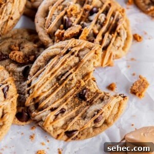 Cookie Butter Chocolate Chip Cookies 10 close up of a chocolate chip Biscoff cookie drizzled with melted cookie butter and cookie crumbs.