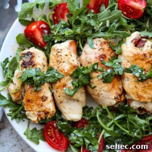 Grilled Chicken Involtini with Prosciutto 11 square image of chicken involtini on platter with arugula salad