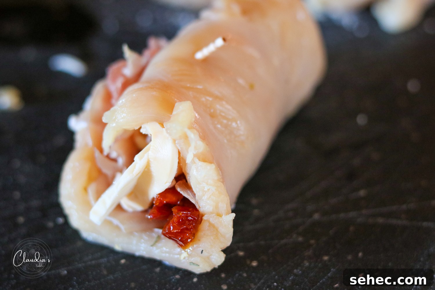 Grilled Chicken Involtini with Prosciutto 9 rolled chicken involtini raw on cutting board