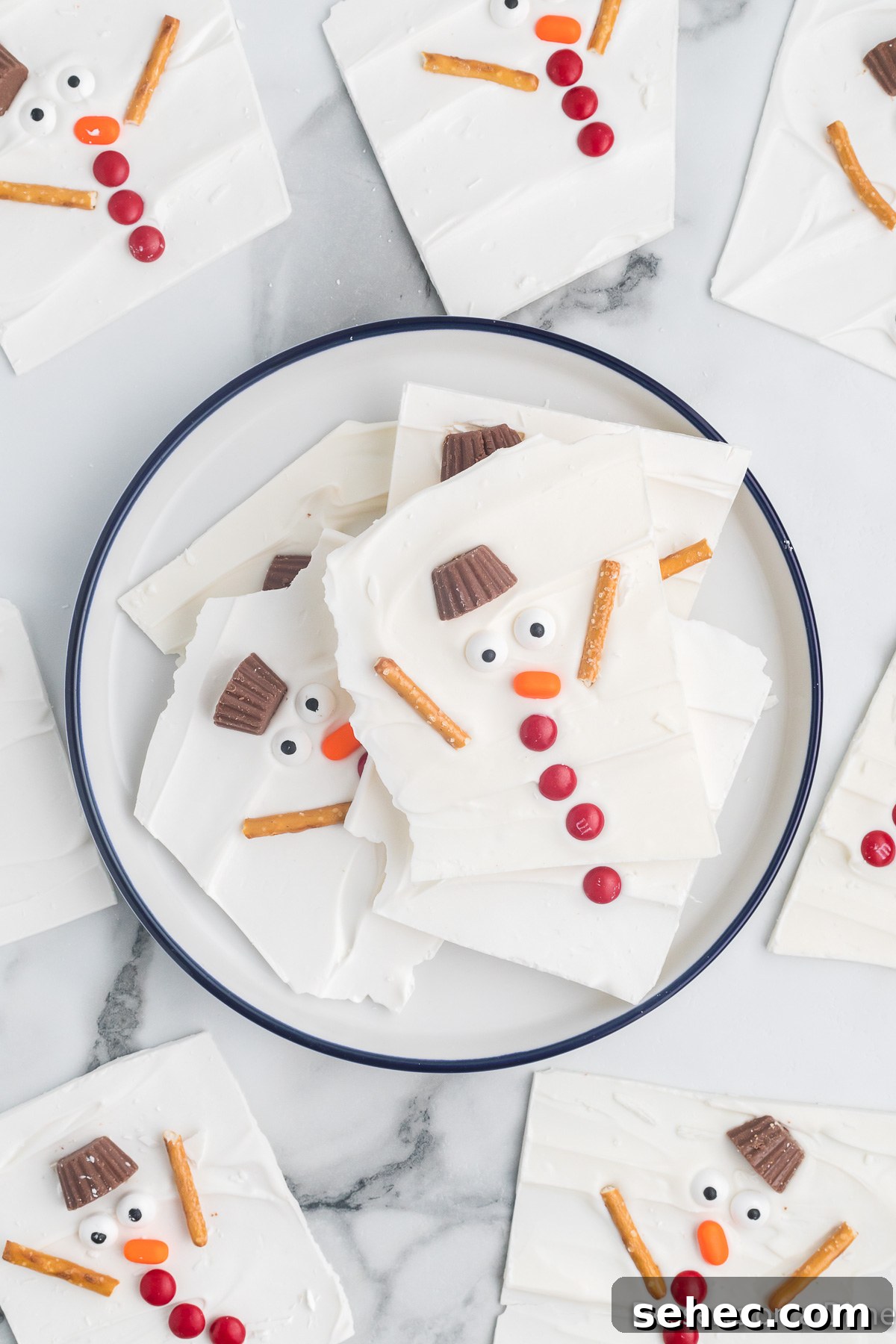 Melted Snowman Chocolate Bark Recipe 12 Melted snowman bark broken into pieces in a bowl.