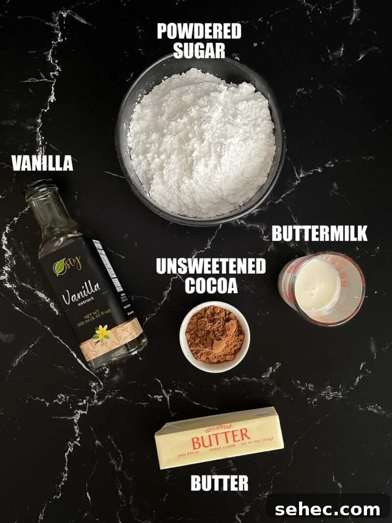 Chocolate buttermilk icing recipe ingredients on a dark surface.