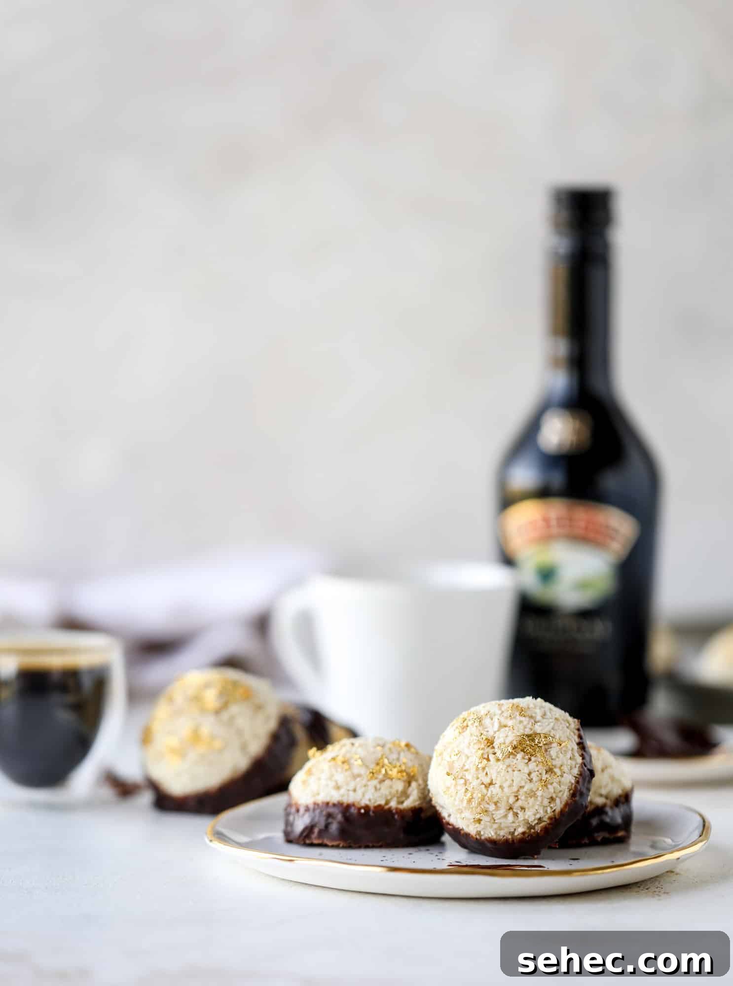 Irish Cream Coconut Macaroons Recipe 6 Classic chewy, slightly gooey coconut macaroons dipped in an irish cream chocolate ganache. Easy to make and gluten free too! I howsweeteats.com #irishcream #coconutmacaroons