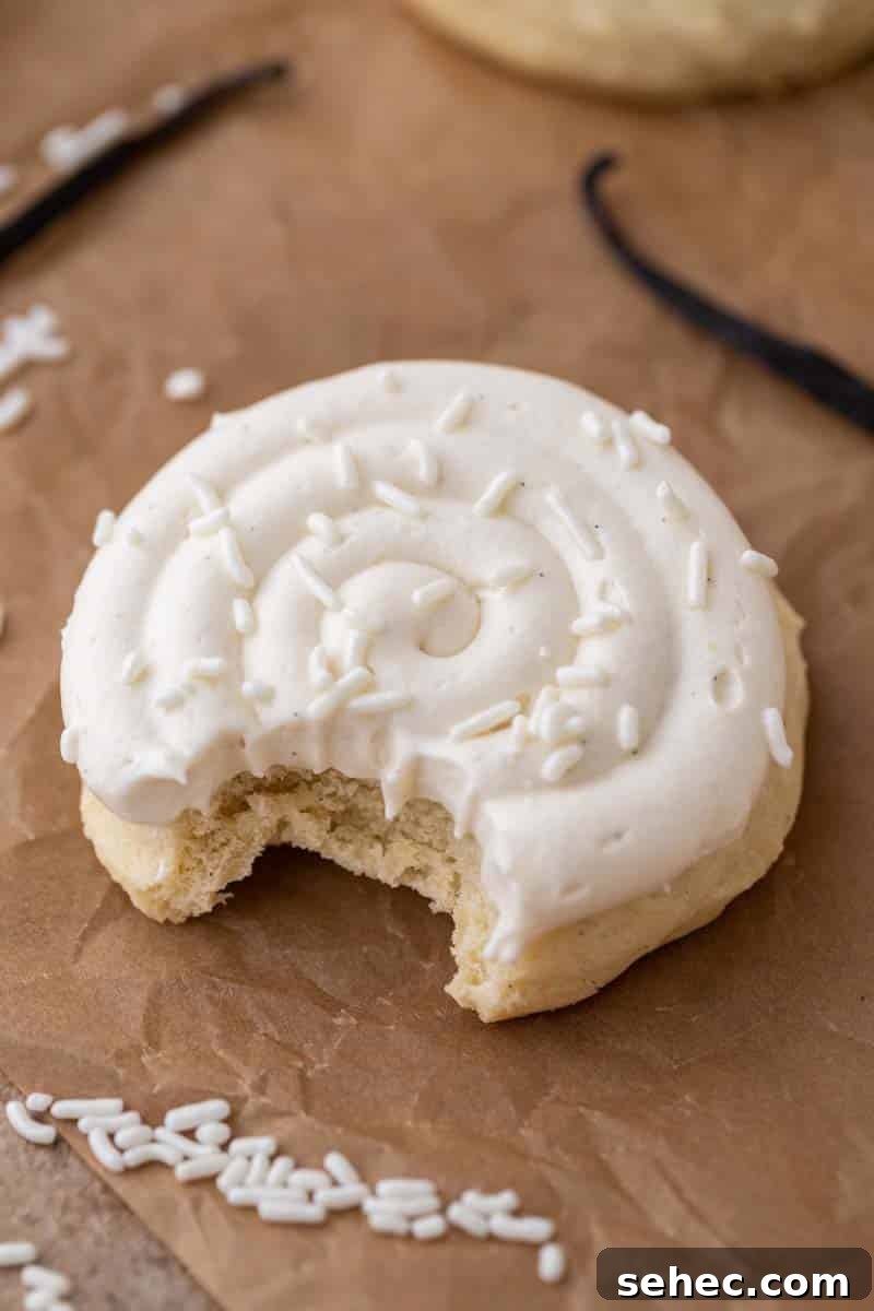 40 Crumbl Cookie Copycat Recipes to Try in 2025 17 Crumbl nilla bean cupcake cookie with a bite taken out of it