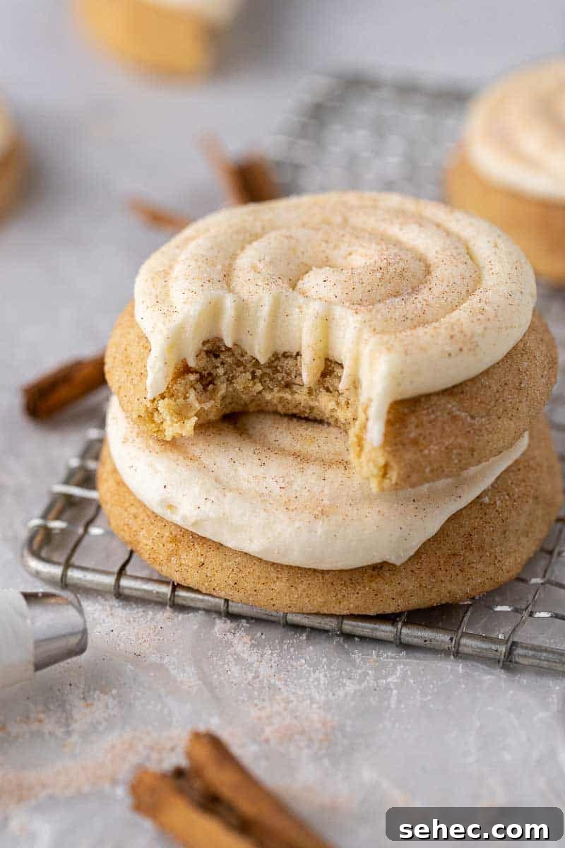 40 Crumbl Cookie Copycat Recipes to Try in 2025 6 Top view of snickerdoodle cupcake cookie with cream cheese frosting swirl