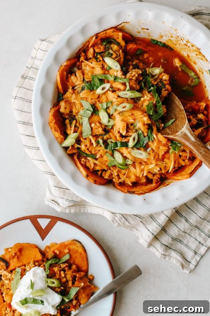 Sweet Potato Enchilada Casserole Recipe 2 Healthy enchilada sweet potato casserole in a baking dish with a wooden spoon and a serving on a plate with sour cream