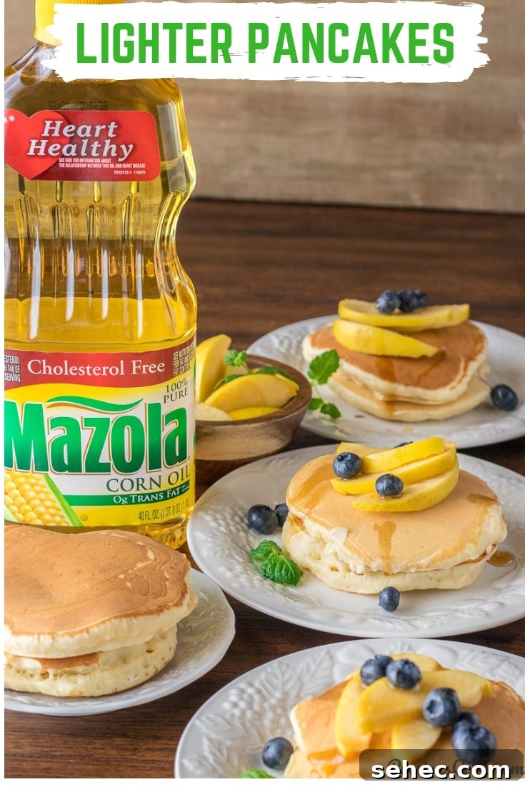Fluffy Old Fashioned Pancakes Made Lighter 8 Plates of pancakes with a bottle of Mazola corn oil.