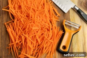Crunchy Cucumber Carrot Salad Recipe 12 This is a picture of carrots being cut into matchsticks.