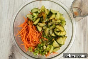 Crunchy Cucumber Carrot Salad Recipe 14 This is a picture of all the veggies and dressing together in a bowl.
