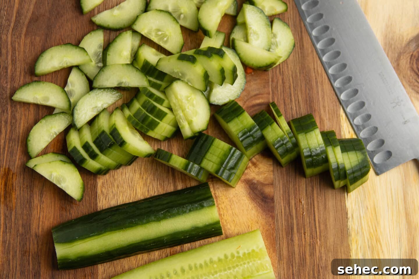 Crunchy Cucumber Carrot Salad Recipe 4 This is a picture of cucumber being sliced.