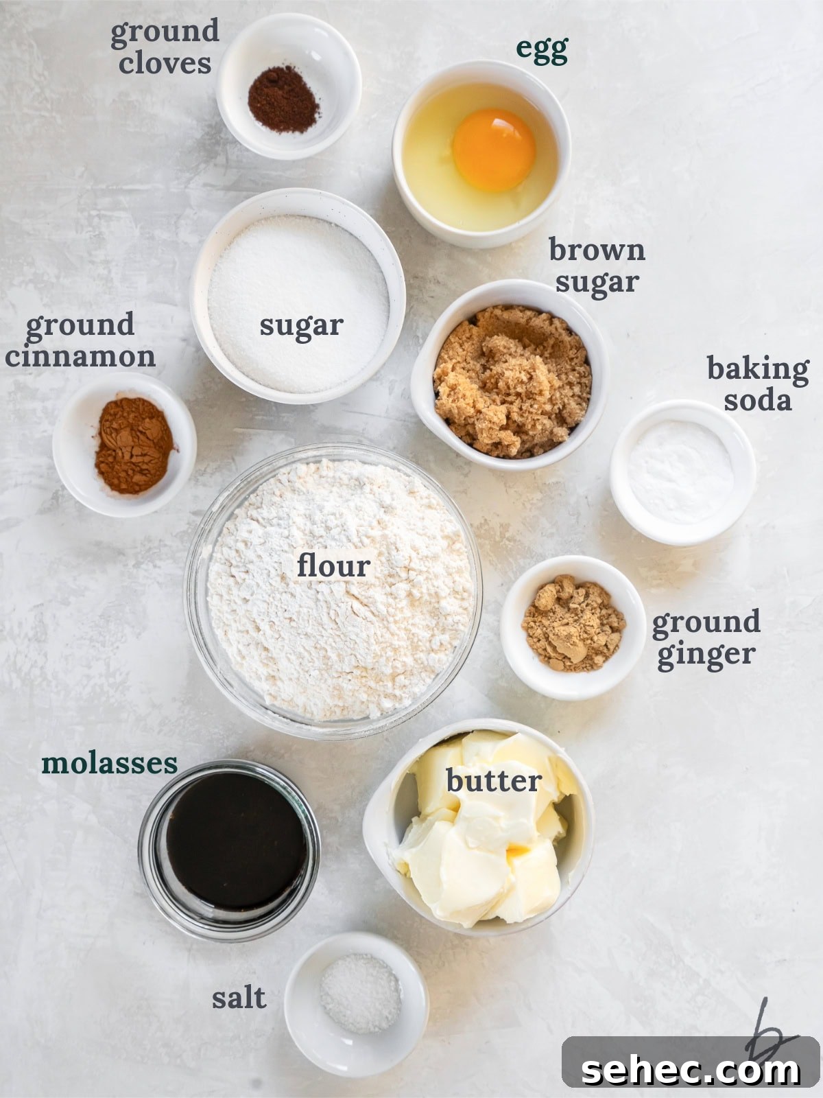 Thin and Crispy Gingersnap Cookies 3 tabletop with bowls of ingredients to make gingersnap cookies.