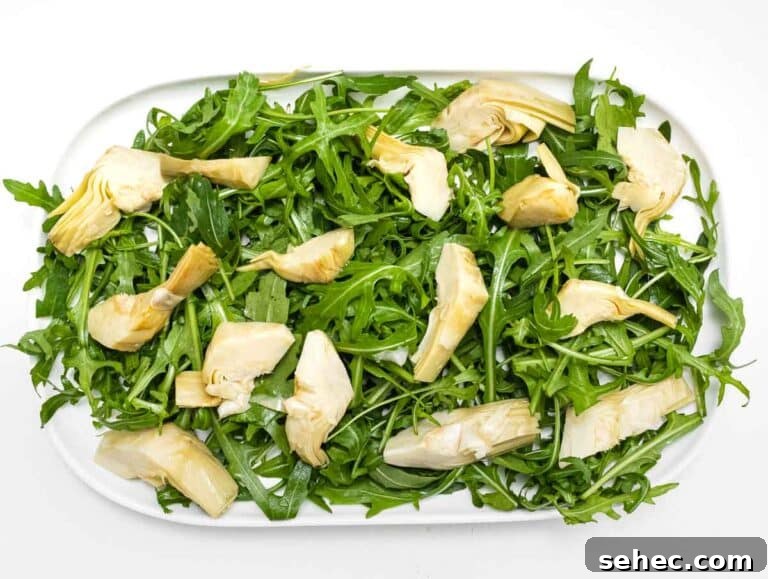 Mediterranean Artichoke Salad with Lemon Vinaigrette 14 arugula and artichoke on a platter
