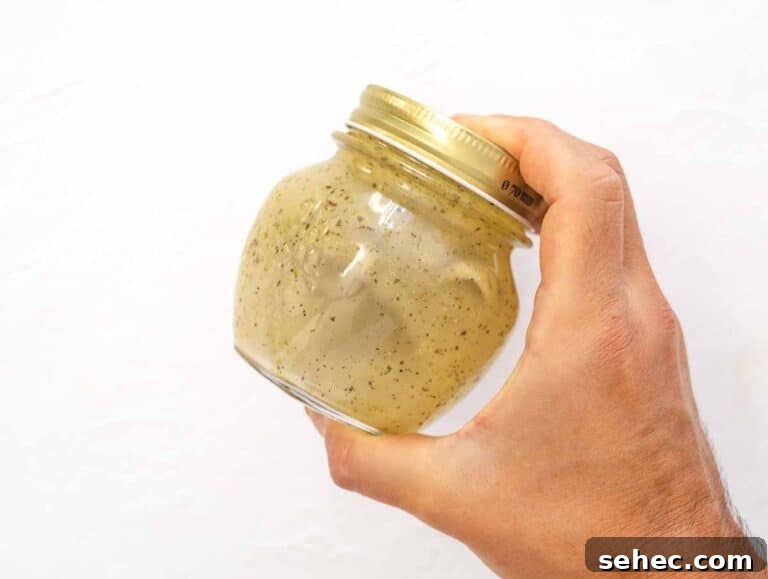 Mediterranean Artichoke Salad with Lemon Vinaigrette 16 shaking the jar with the ingredients