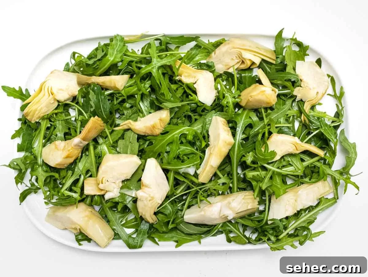 Mediterranean Artichoke Salad with Lemon Vinaigrette 4 arugula and artichoke on a platter