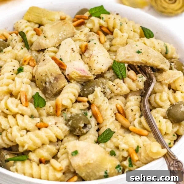 Mediterranean Artichoke Salad with Lemon Vinaigrette 9 Artichoke pasta in a white bowl