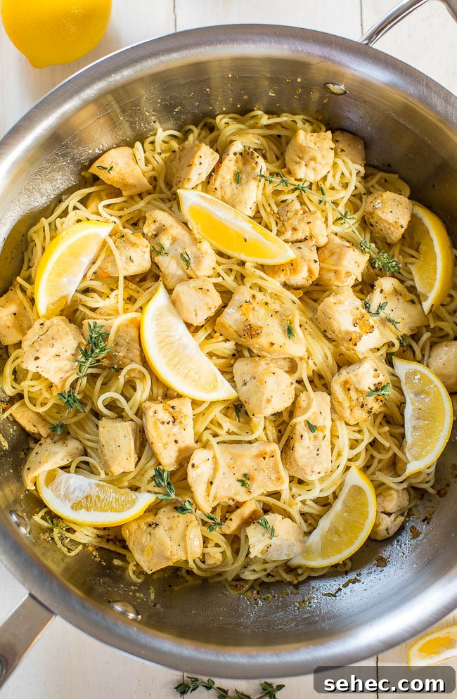 Chicken Asparagus Pasta with Tomatoes 17 Honey Lemon Chicken Pasta in skillet with lemon wedges.