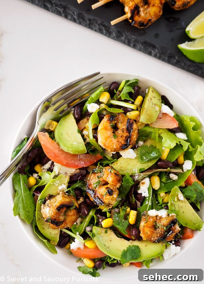 Southwestern Grilled Shrimp Salad with Avocado 4 Southwestern Grilled Shrimp Salad served in bowl.