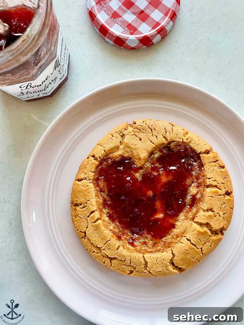 Giant Peanut Butter and Jelly Cookies for Two 2 Up close overhead photo of a large peanut butter cookie with a jelly heart indent.