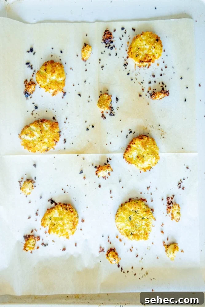 Crispy Baked Goat Cheese Balls Recipe 11 baked goat cheese balls and garlic cloves rolled in breadcrumbs on parchment paper