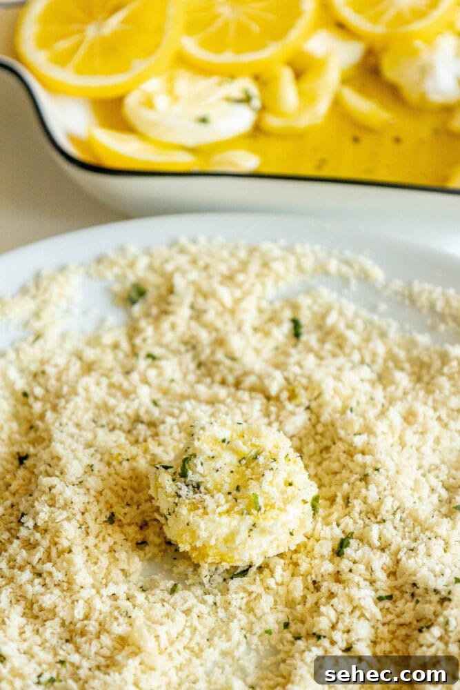 Crispy Baked Goat Cheese Balls Recipe 9 goat cheese being rolled in breadcrumbs
