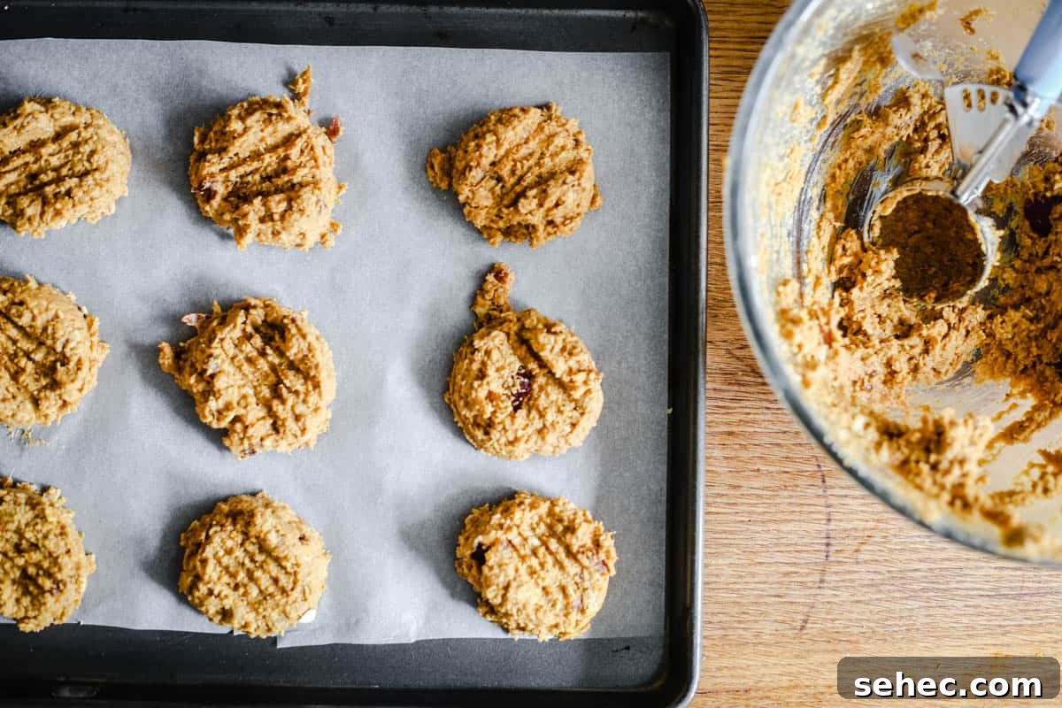 Gluten Free Pumpkin Cookies with Warm Fall Spices 5 baking tray of cookies on a table