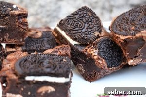 Fudgy Oreo Brownies with a Rich Chocolate Center 3 Fudgy Oreo brownies with a crackly top and cookie pieces