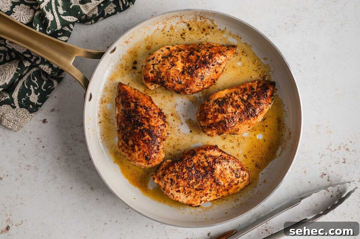 Garlic Lime Chicken Recipe with Juicy Citrus Flavor 5 Cooked chicken breasts in a skillet.