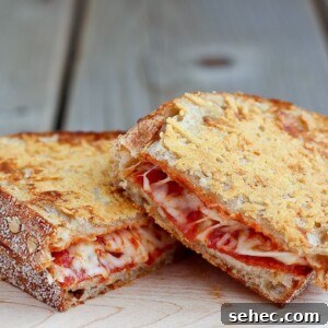 Pepperoni Pizza Grilled Cheese with Parmesan Crust 3 Pepperoni Pizza Grilled Cheese with a crispy parmesan cheese crust - so good you'll never go back to plain grilled cheese! Find the recipe on RachelCooks.com