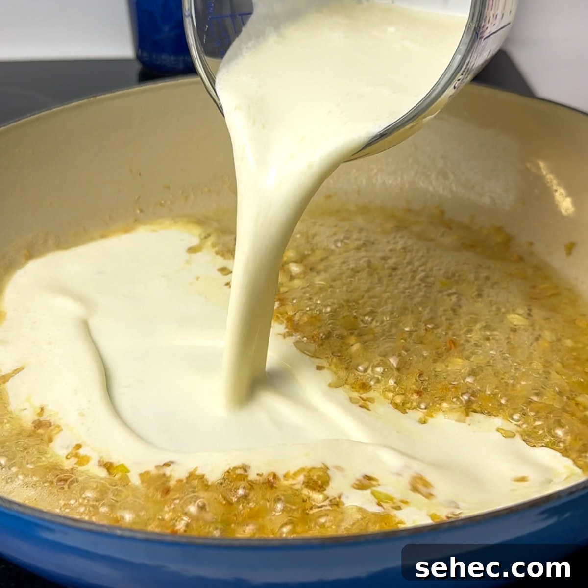 Creamy Garlic Penne Pasta Recipe 5 Add heavy cream flour slurry and Asiago cheese