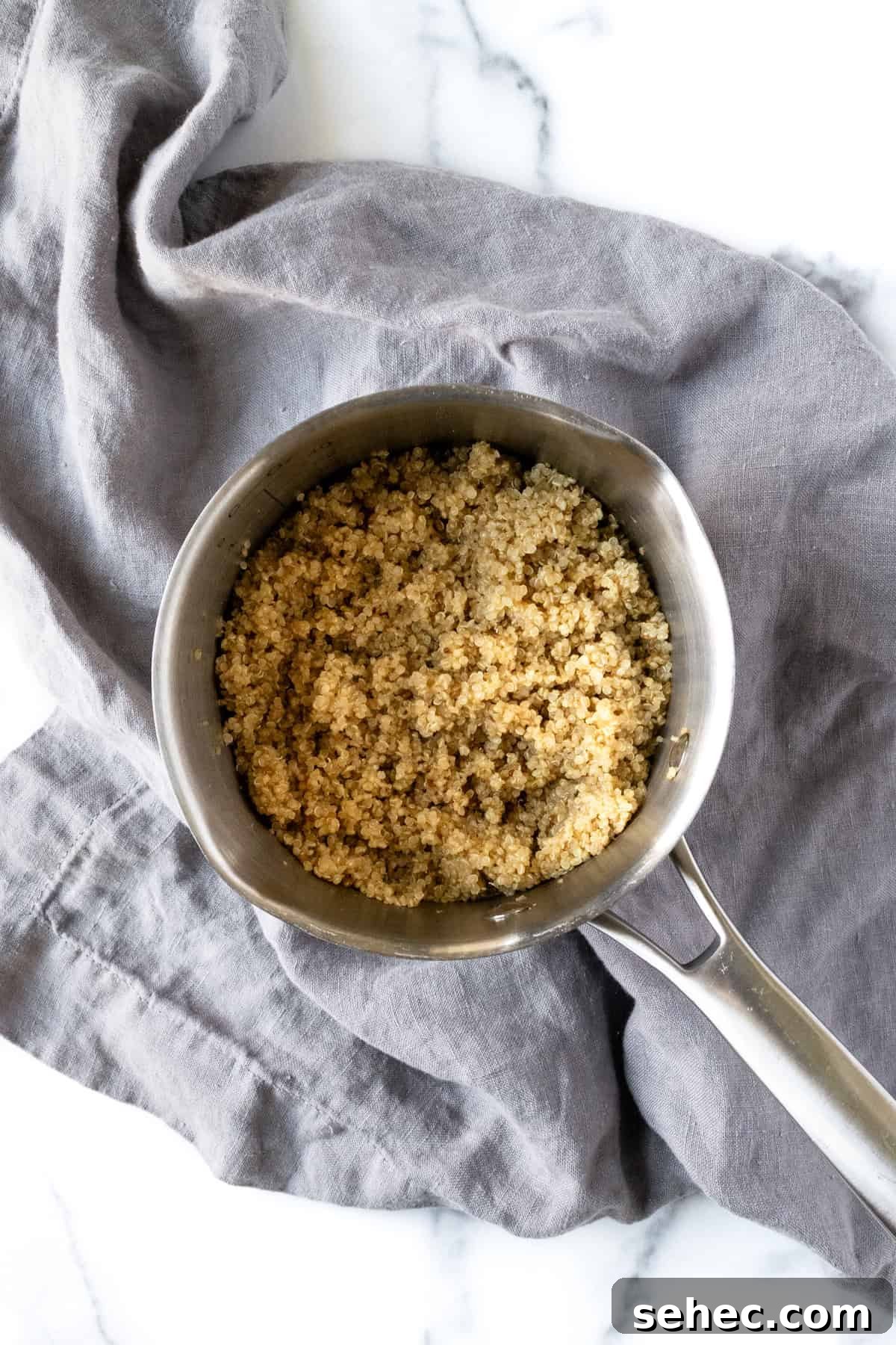 Apple Cranberry Quinoa Salad for Fall 4 Cooked Quinoa in a Small Pot.