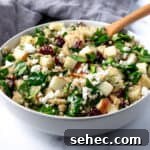 Apple Cranberry Quinoa Salad in a white bowl.