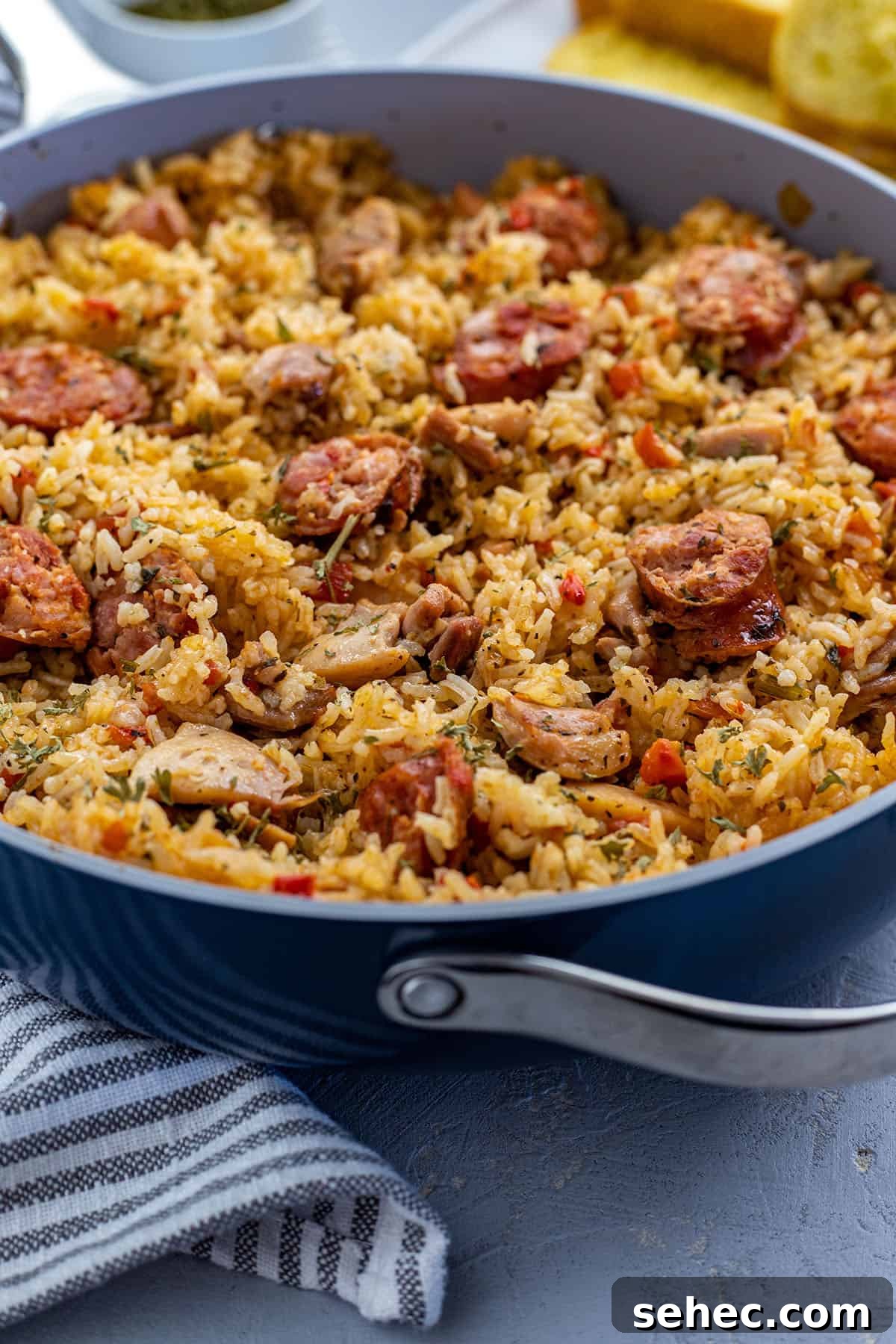 Cajun Chicken and Sausage Jambalaya Recipe 2 Cooked Chicken and Sausage Jambalaya in pan with toasted french bread on the side.