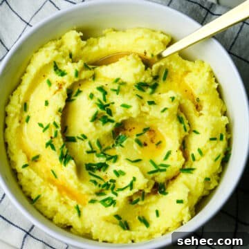 mashed potatoes with butter drizzle and fresh chives.