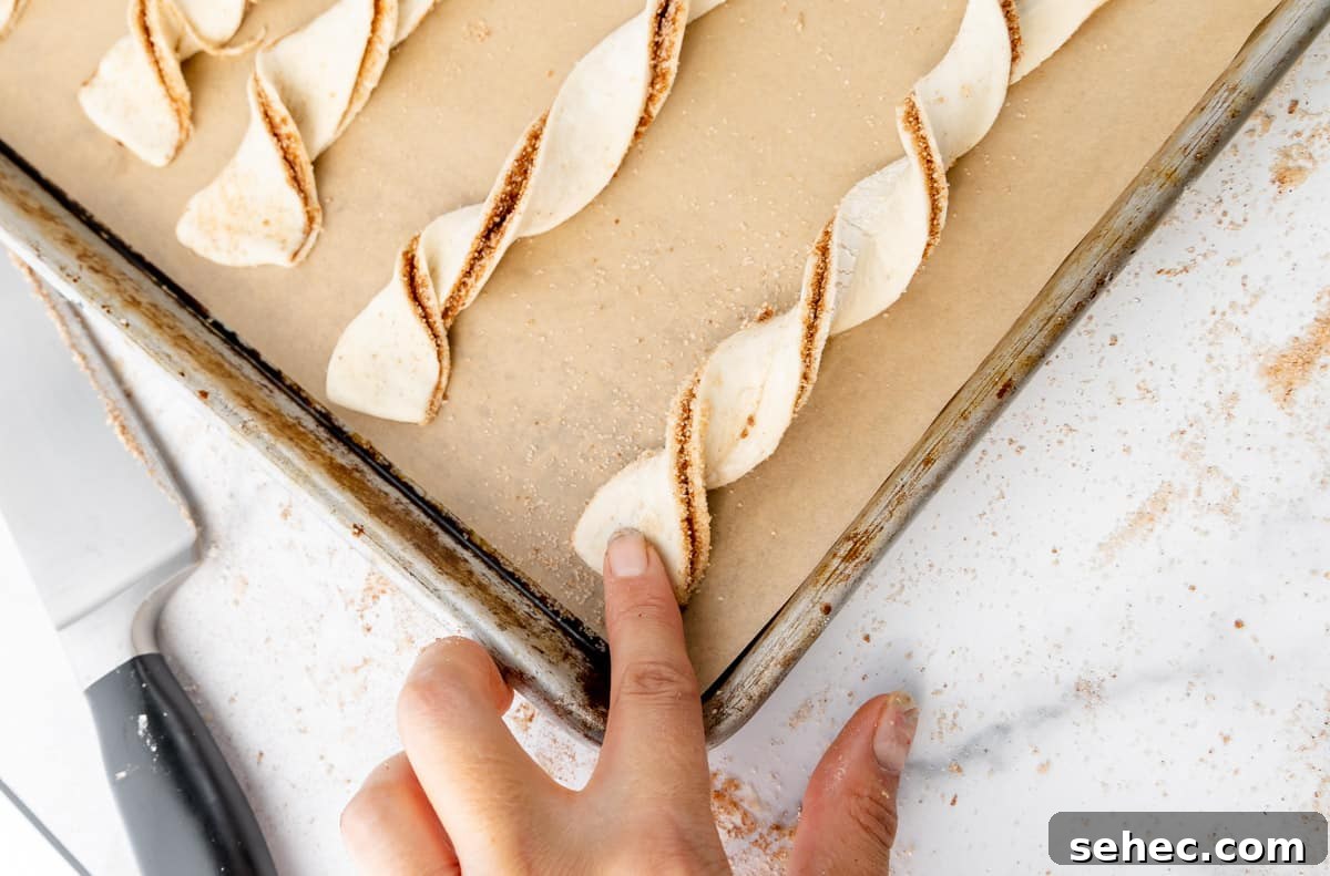 Cinnamon Sugar Puff Pastry Twists 7 Flatten the ends of the twists to the sheet pan.