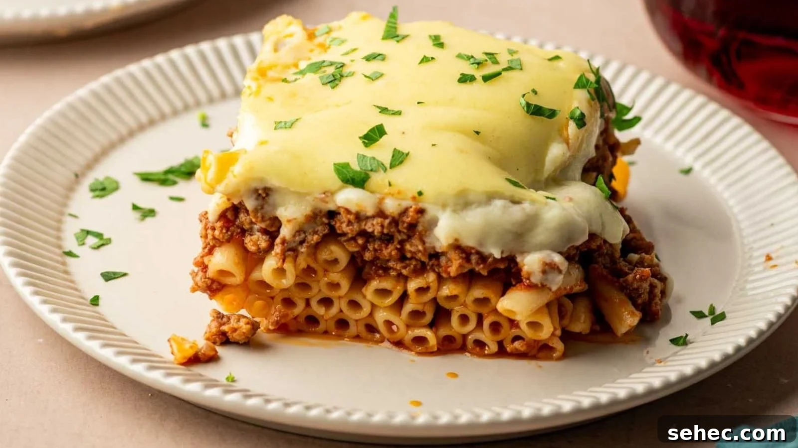 Layered baked pasta with meat sauce and béchamel.