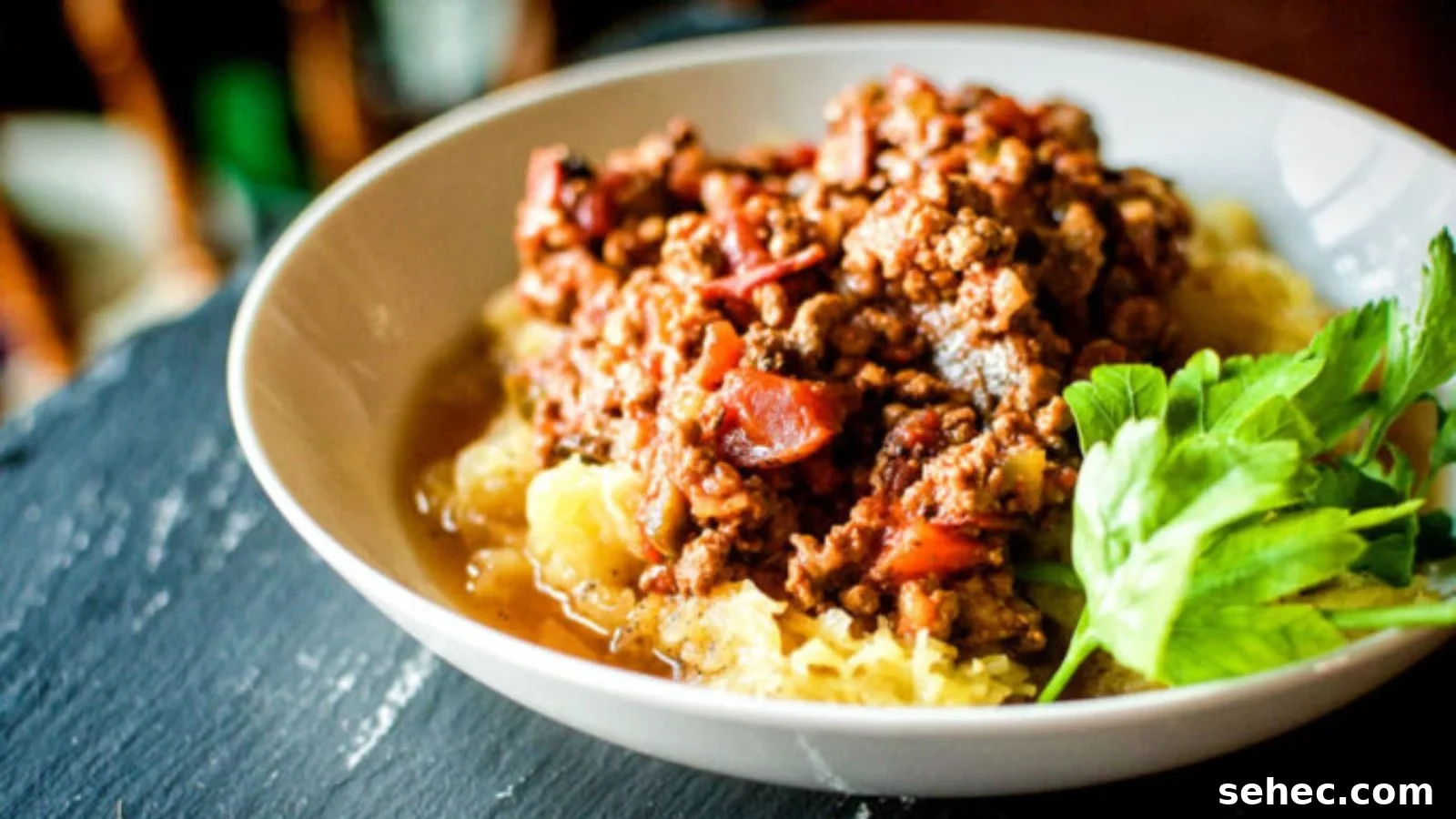 Bolognese sauce slow cooked paleo style with vegetables and meat simmering thick.