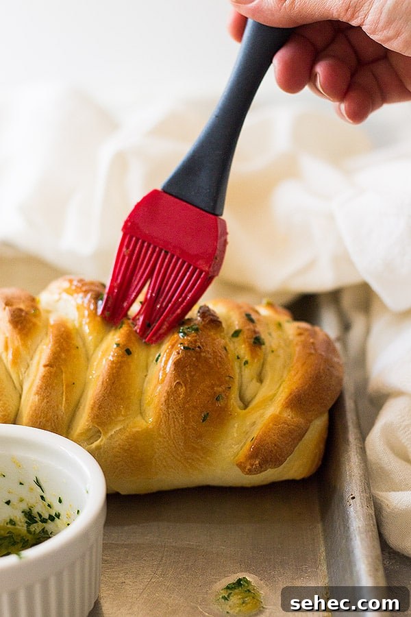 Three Cheese Braided Bread Recipe 2 This Three Cheese Braid is filled with ooey, gooey cheese and brushed with butter and garlic.
