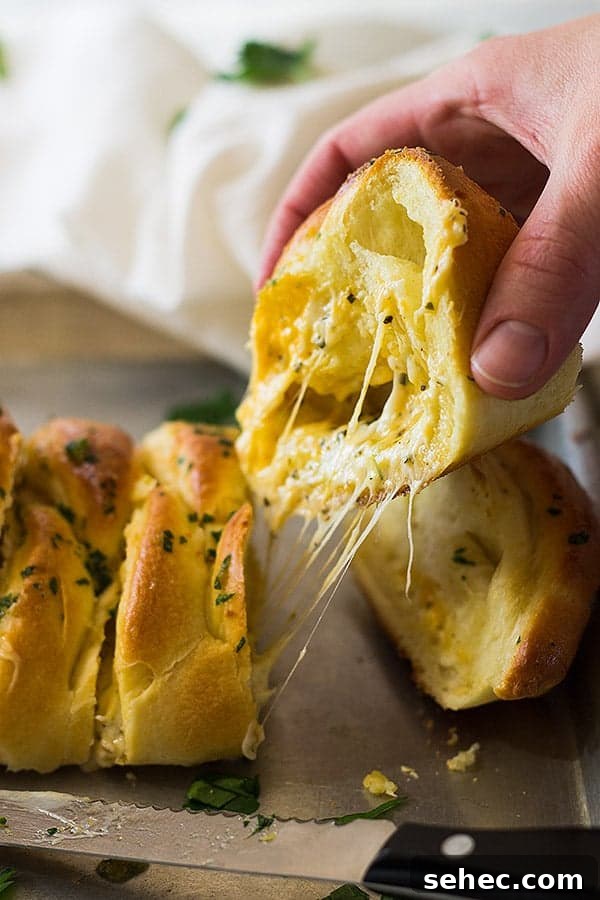 Three Cheese Braided Bread Recipe 4 This Three Cheese Braid is filled with melted mozzarella, cheddar and Parmesan cheese. Then baked in a golden crust and brushed with butter and garlic!