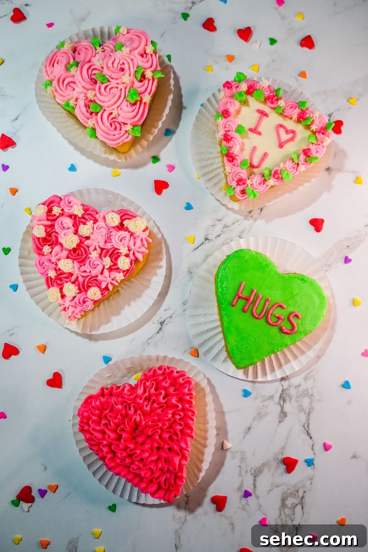 Mini Heart Cakes Made Two Ways 8 Mini heart cakes decorated with colorful buttercream designs.