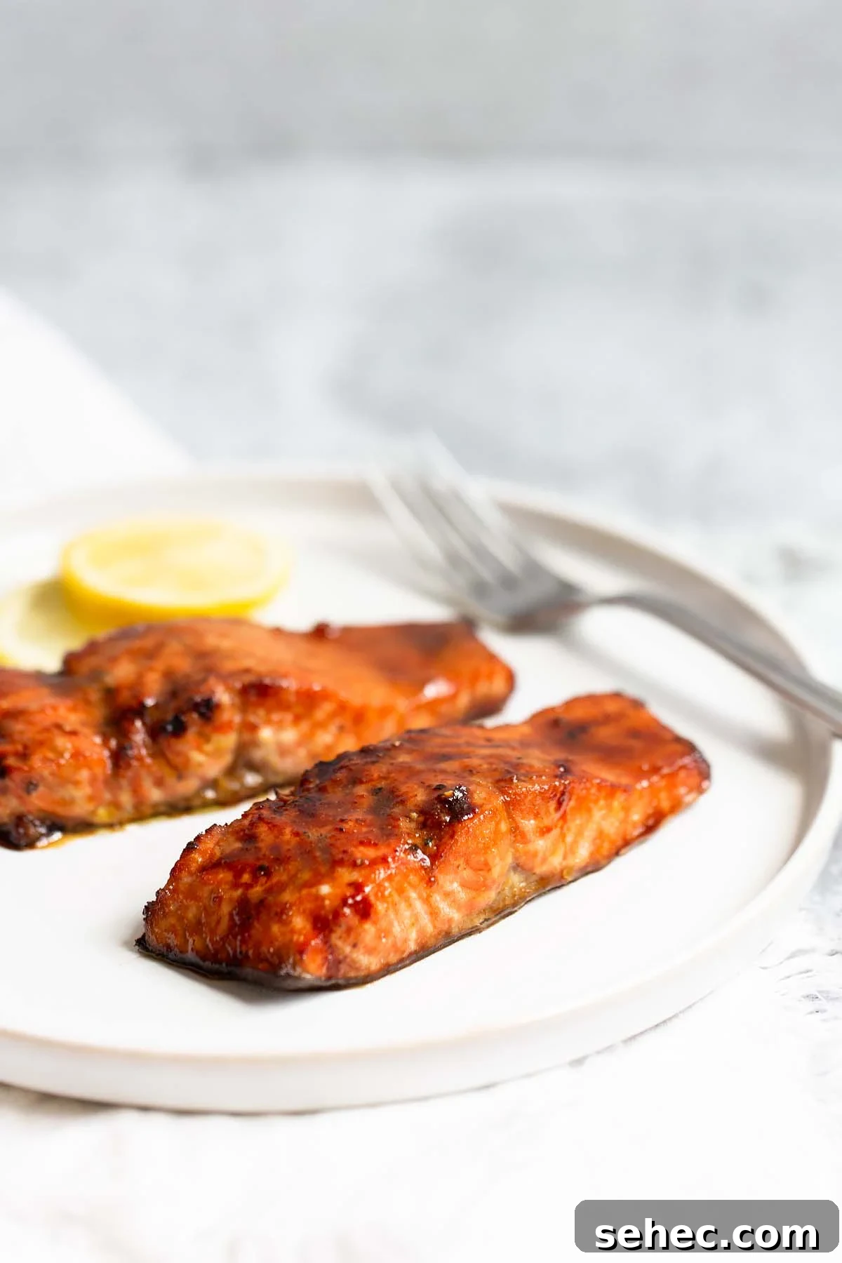 Crispy Skin Air Fryer Salmon Recipe 11 Two pieces of cooked salmon from the side.