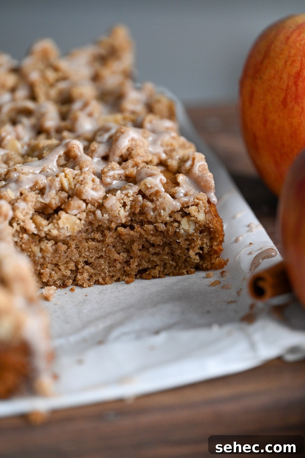 Moist Applesauce Crumb Cake with Cinnamon Streusel 5 close up view of homemade applesauce coffee cake with a crumb topping made from oats and flour.