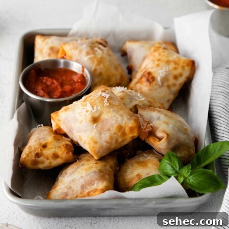Crispy Air Fryer Pizza Rolls Recipe 10 tray with air fryer pizza rolls on it
