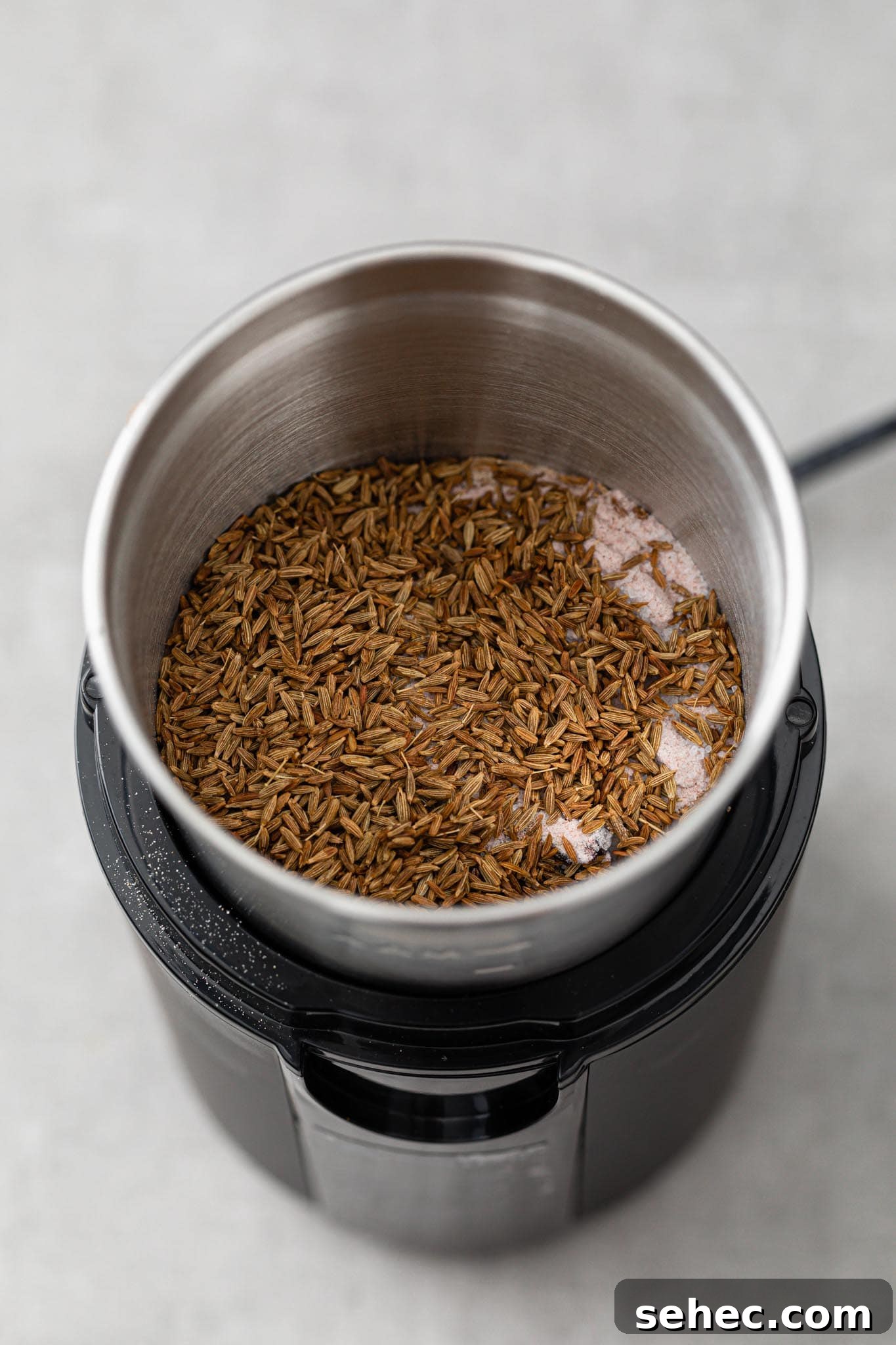 Authentic Chaat Masala Recipe: Homemade Indian Spice Mix 7 Spices in a spice grinder ready to be ground for chaat masala