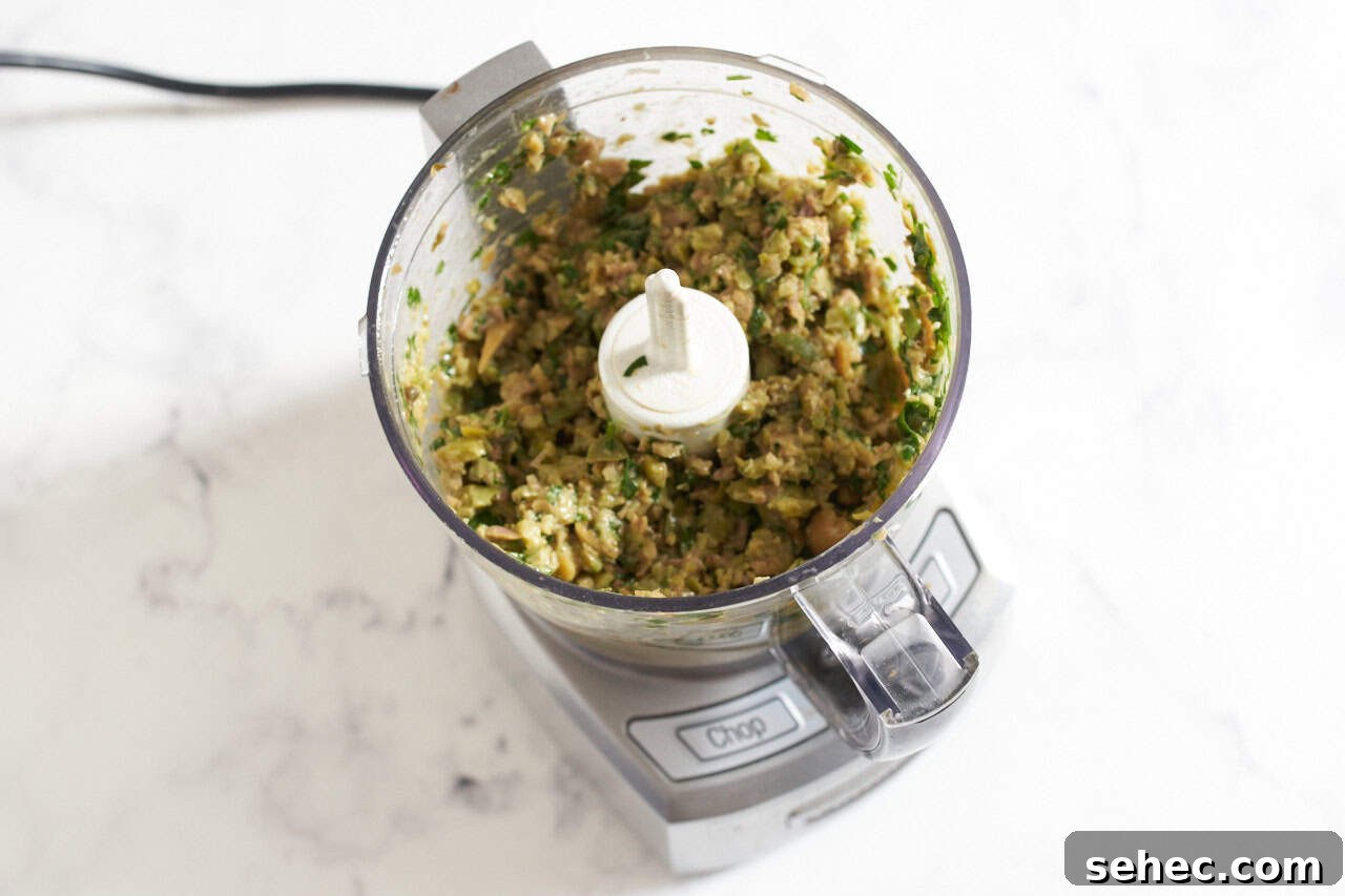 Homemade Green Olive Tapenade Recipe 5 Green olive tapenade in a min-food processor.