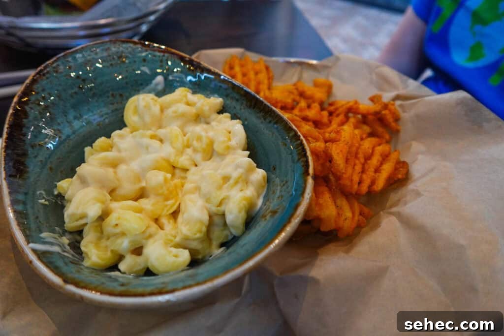 Rix Sports Bar and Grill - Live Sports, Craft Beer and Burgers 7 kids mac n cheese with waffle fries from Rix Spors Bar and Grill.