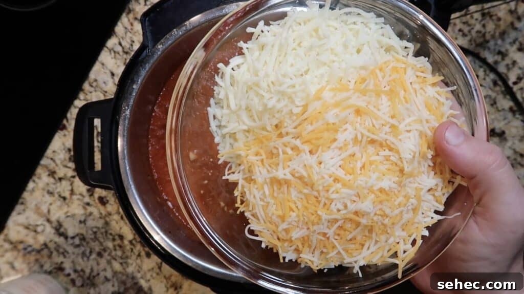 Adding shredded cheese to pot