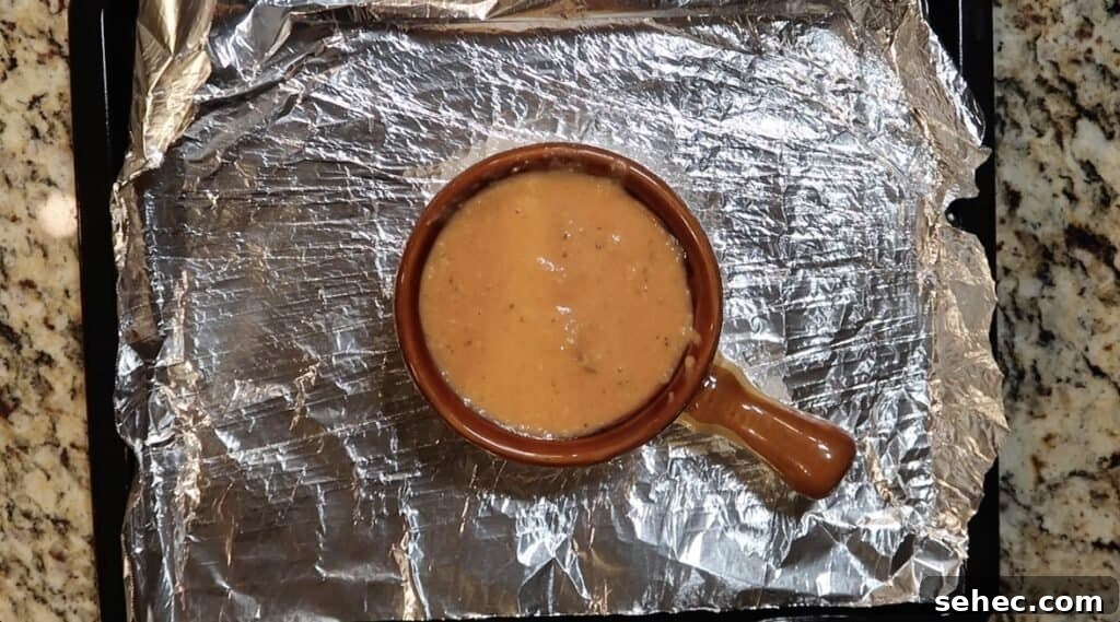 Ladling soup into crocks