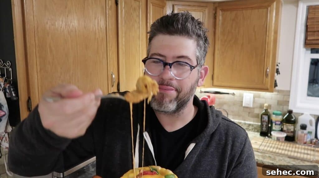 Man with cheesy spoon