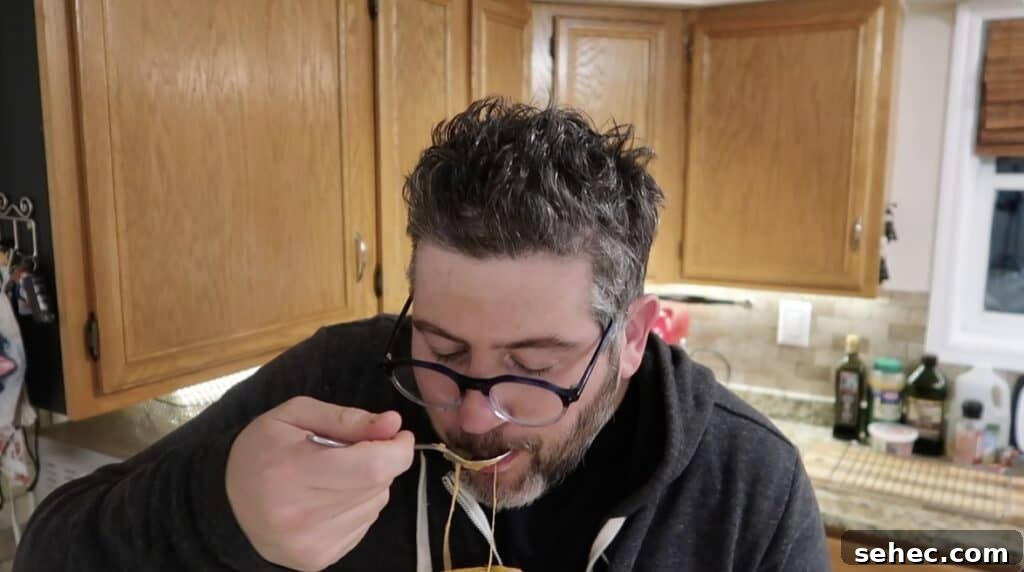 Man slurping soup