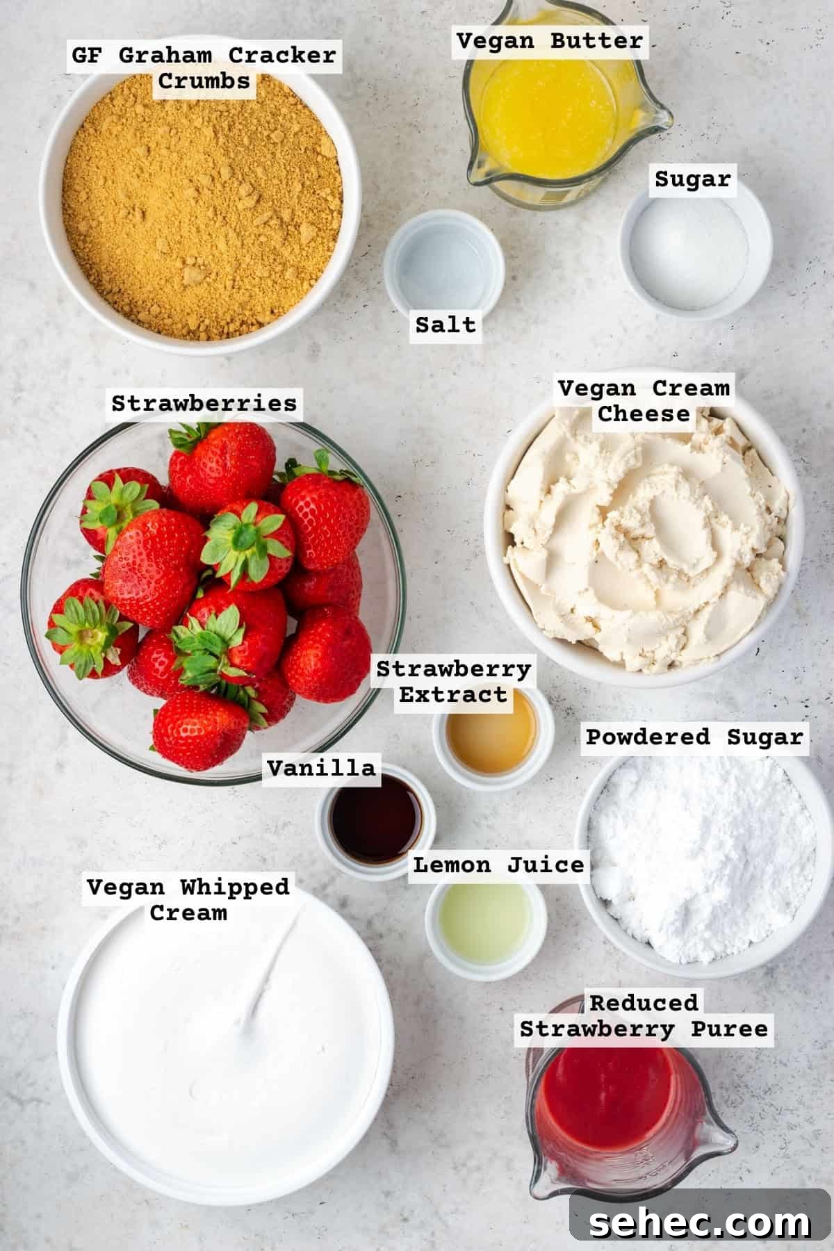 No Bake Strawberry Cheesecake Cups 3 Ingredients for strawberry delight sitting on a white table.
